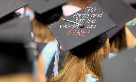 Graduation cap with phrase Go Forth and Set the World on Fire