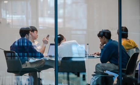 A group of people sitting at a table.