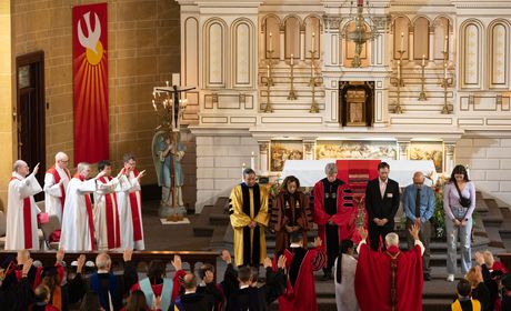 SU's newest administrators receive a special blessing during the university's Mass of the Holy Spirit.