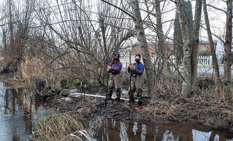Two Students Near a River