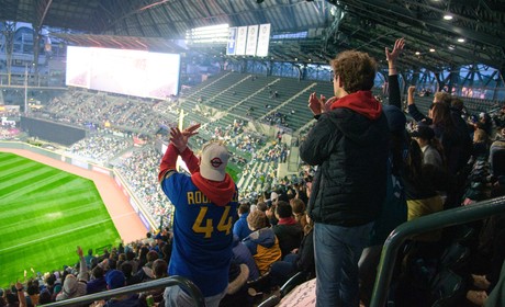 A stadium full of people watching a soccer game.