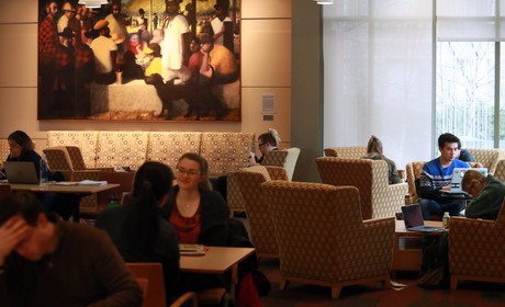 A group of people sitting at tables.