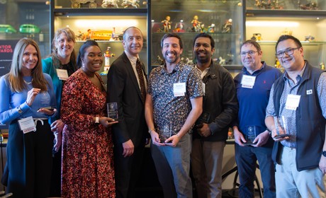 Mentors posing with their mentor awards
