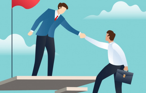 One person giving another a hand up