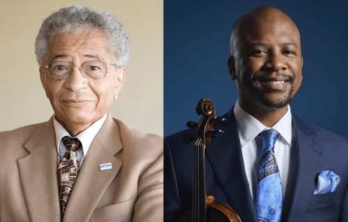 two men side by side one holding a violin
