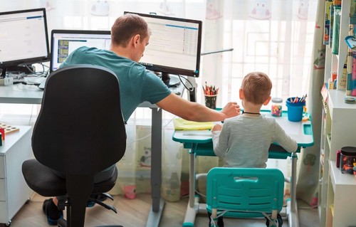 Father and son working from home