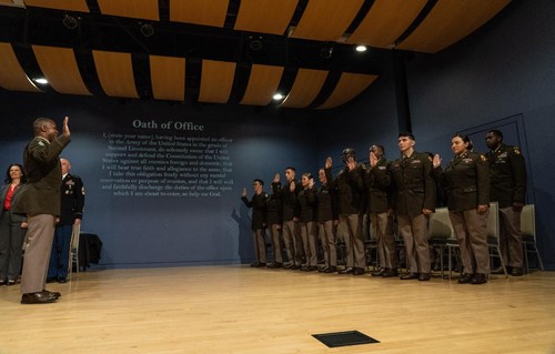 Cadets in uniform making an oath