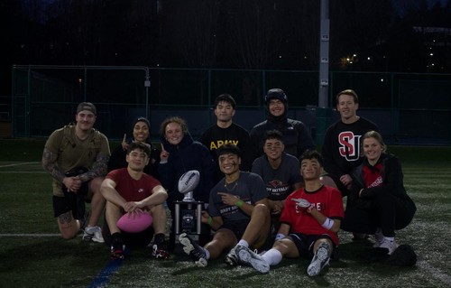 Cadets in sports clothes with trophy