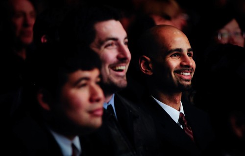 Three students smiling