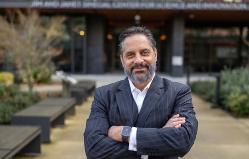 A portrait photo of Eduardo in front of the Sinegal Center