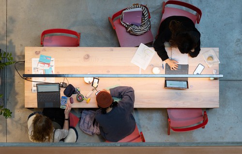 Students studying at a table in the Sinegal Center for Science and Innovation.
