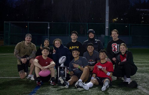 Cadets in sports clothes with trophy