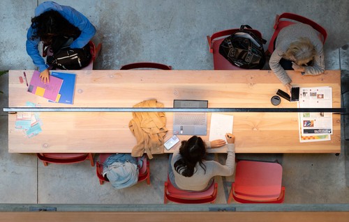 Students studying at a table in the Sinegal Center for Science and Innovation.