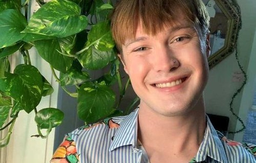 A profile photo of David Cumptson sitting in front of hanging plants