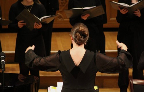 Photo of Leann Conley-Holcom conducting