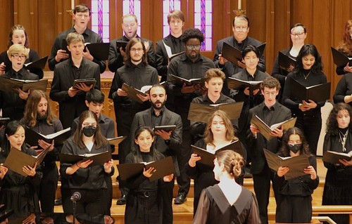 Photo of Leann Conley-Holcom conducting the choir