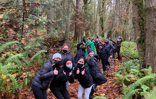 students in front of tree