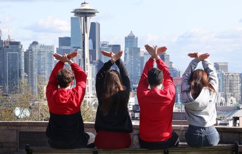 Four students looking at Space Needle.