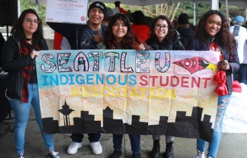 A group of 6 people holding a sign that says Indigenous student club
