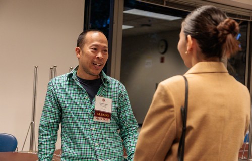 John Paramadilok talks with an attendee at the Albers mentor fair