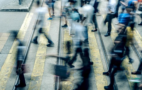 A blur of people at a pedestrian crossing