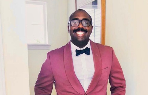 Timothy Jolliff smiling in a suit