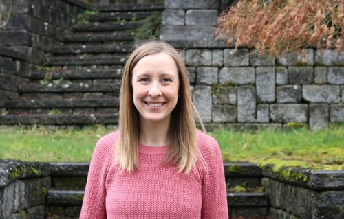 Image of Megan Cycyota standing outside in a garden