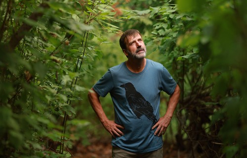 A portrait of Derrek Sheffield in the forest