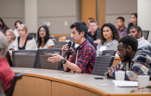Person asking a question at Projects Day presentation