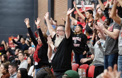 Alumni cheering during a homecoming game