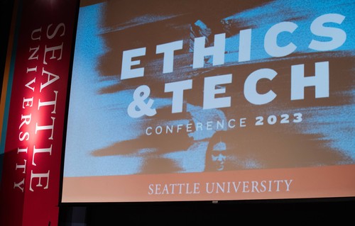 Ethics and Tech Conference slide on screen of auditorium