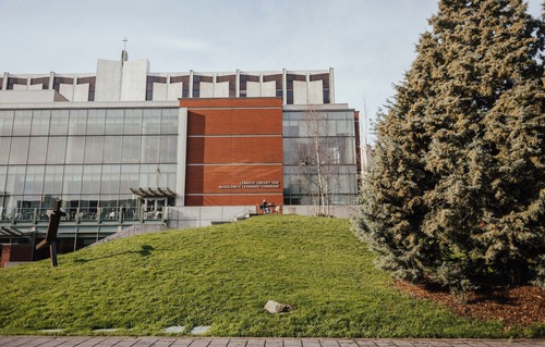 A large building with a grassy area in front of it.
