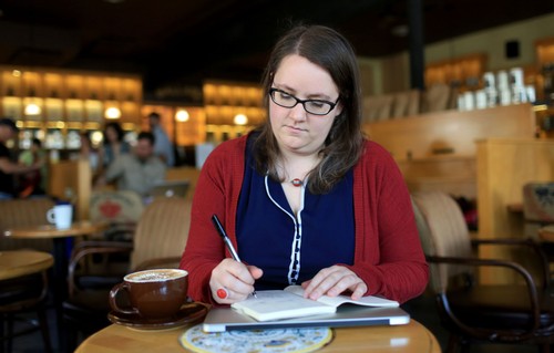 Woman writing in a notebook