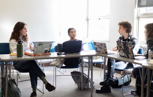 A group of people sitting at a table.