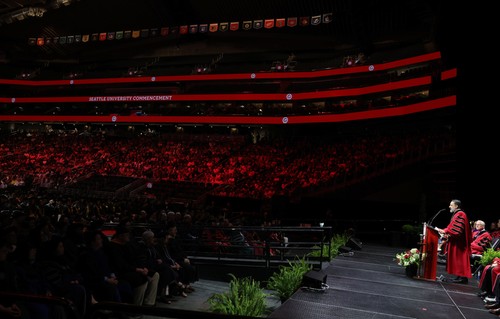 President Peñalver on stage inside the Climate Pledge Arena