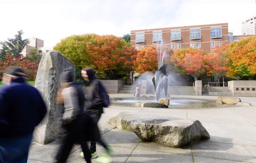 Students walking past the Quad fountain at Seattle University