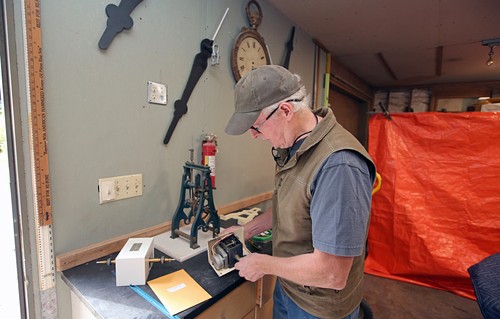 clock restorer george in shop