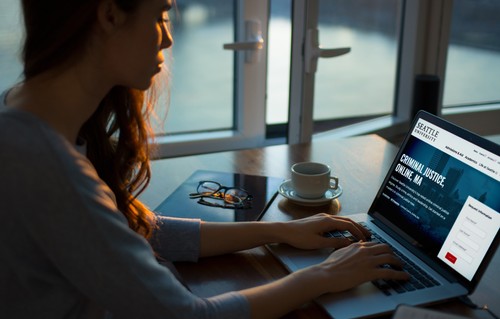 A photograph of a student exploring online graduate programs