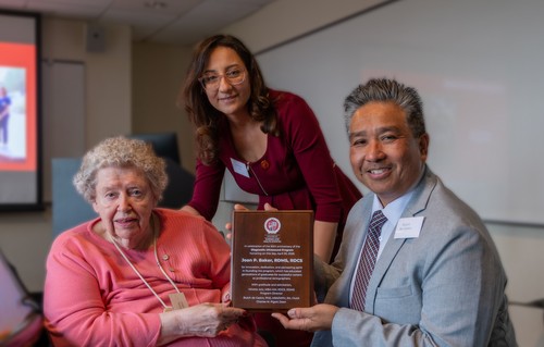 Joan Baker receiving an award at Seattle University