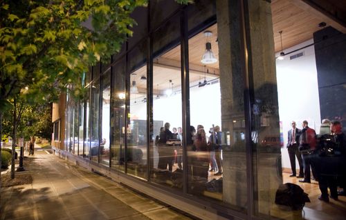 Photo of Lee Center for the Arts from outside with lights on in lobby