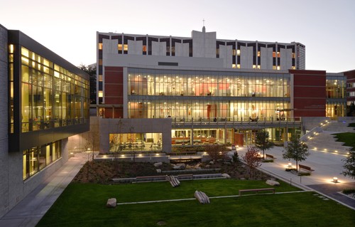 An aerial view of a campus building at dusk.
