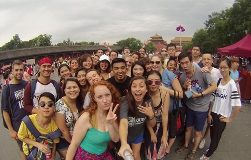 a group of people taking a selfie