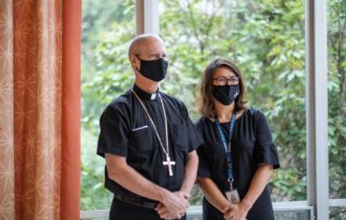 Photo of Seattle Archbishop Paul D. Etienne and Renée Rassilyer-Bomers, ’03, ’05, ‘16
