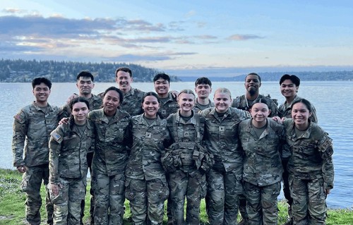 Cadets in greens in front of lake