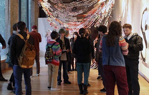 Photo of people at exhibition reception
