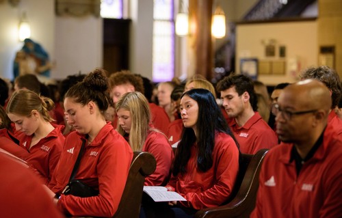 student looking contemplative while attending Mass of the Holy Spirit