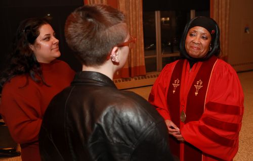 Three people at an academic event