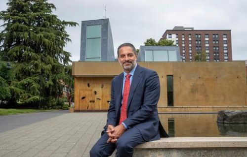 Eduardo sitting in front of St. Ignatius