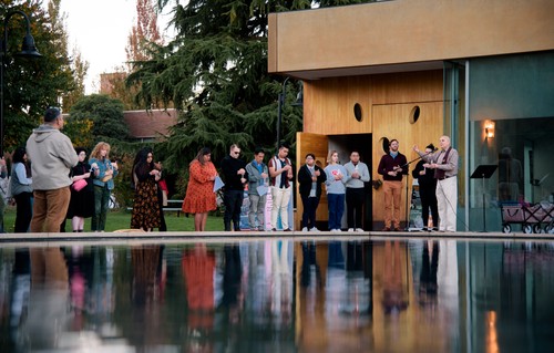 Students gathered by the reflection pool outside the SI chapel for Vigil