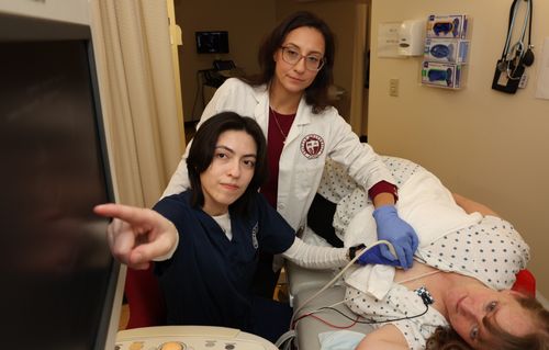 Ultrasound student and professor look at imaging